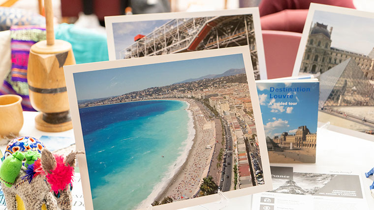 Passports and souvenirs are displayed on a table.